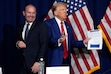 (Evan Vucci | AP) Donald Trump with Sen. Mike Lee, R-Utah, in fall 2024. Lee is calling for an investigation of a social media post by Trump critic James Comey.